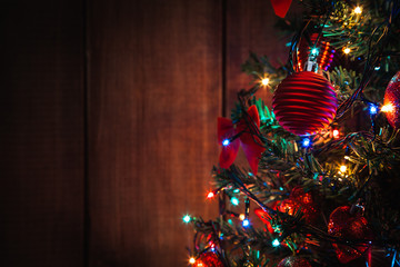 Christmas fir tree with balls and garland. Christmas night. Background with copy space.