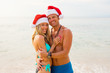 © Kaspars Grinvalds - Couple on tropical beach during winter holidays