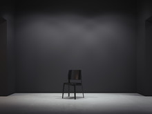 Black Chair In Dark Interior. 3d Rendering
