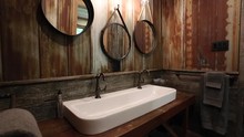 Amazing Washroom With Rusted Industrial Styled Tin Walls