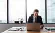 © Jacob Lund - Businessman working at his desk and smiling