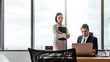 © Jacob Lund - Two business people looking at laptop