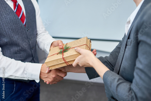 Fotografía Close up view of unrecognizable businessman shaking hands with female colleague