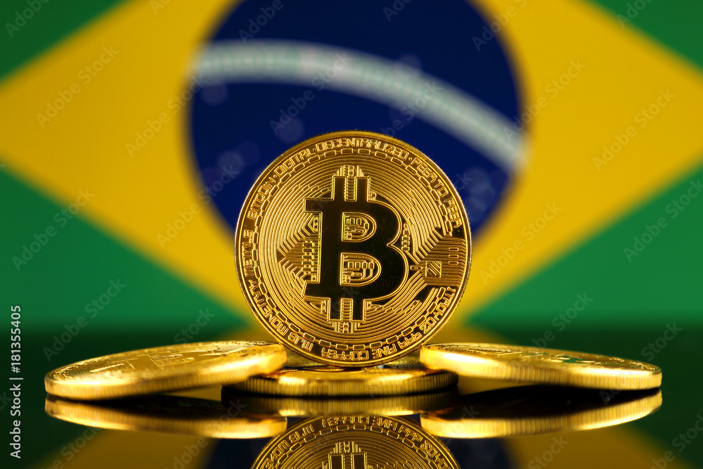 Physical version of Bitcoin (new virtual money) and Brazil Flag. Conceptual image for investors in cryptocurrency and Blockchain Technology in Brazil.