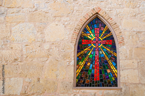 Fotomural Gothic style church window with stained glass/ red cross made of stained glass