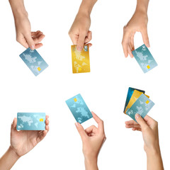 Wall Mural - Women holding credit cards on white background