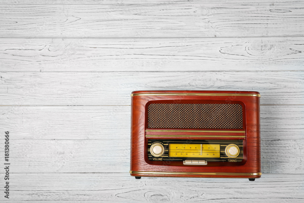 Retro radio on wooden background