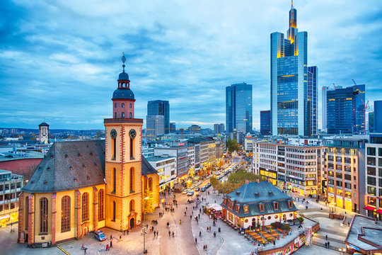 Wall Mural -  - View to skyline of Frankfurt in sunset blue hour. St Paul's Church and the Hauptwache Main Guard building at Frankfurt central street Zeil.