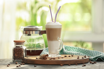 Wall Mural - Glass with latte macchiato on table