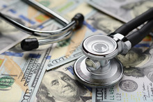 Medical Stethoscope And Dollar Bills