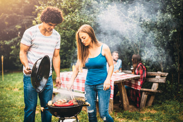 Young people making barbecue