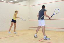 Couple Playing Squash