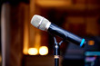 © Story Images  - Microphone on the rack close-up on a blurred background