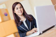 © whyframeshot - hapiness and joyful asian woman makes online shopping or selling products in a room with laptop and brown boxes of items