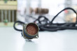 © nordroden - Circular multi-pin connector lie on the table.