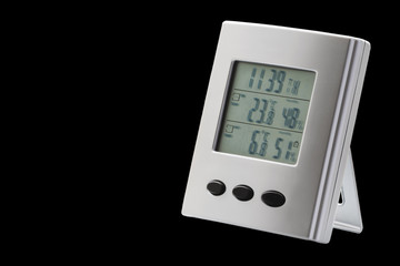 Wall Mural - Weather station device with weather conditions inside and outside isolated on the black background. Selective focus