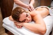 © pantovich - Masseur woman doing relaxing massage of the young girl in Spa salon close up