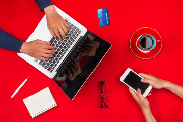 Wall Mural - two young man using laptop and a smartphone.focus on the hand