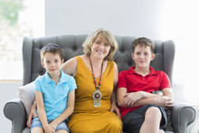 Mid-age Woman With Two Boys Indoor