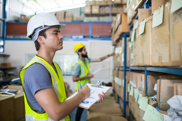 Warehouse worker checking stock products for prepare to packing to customer.