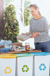 © Photographee.eu - Pretty woman and recycling containers