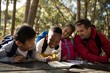 © WavebreakMediaMicro - Teacher assisting kids in studying
