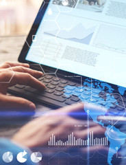 concept of virtual diagram,graph interfaces,digital display,connections,statistics icons.man using s
