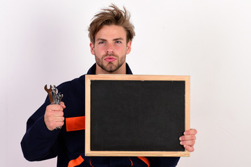 Wall Mural - Man with beard and serious face holds chalkboard