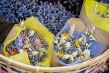 Close-up Of Creative Bouquets Of Fresh Lavender Flowers In Wicker Basket, Flower Shop, Studio. Delivery Of Flowers, Smell Plants, Aroma