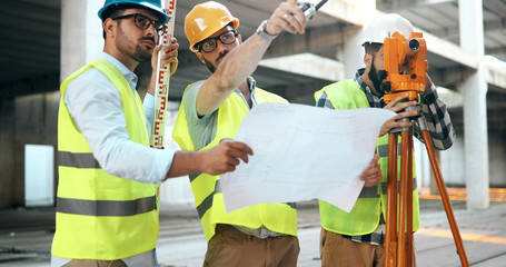 Group of engineering team had meeting at working site