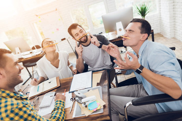 Wall Mural - Employees of the company are having fun during the break of the business meeting.