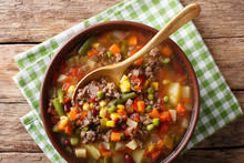 Hamburger Soup With Ground Beef And Vegetables Close-up In A Bowl. Horizontal Top View