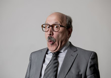 Portrait Of 60s Bald Senior Happy Business Man Gesturing Funny And Comic In Laughter And Fun Face Expression Looking Happy