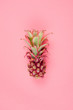 Small pink pineapple on the light pink background