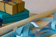 Gift wrapping, close-up paper, gift boxes, ribbons and scissors on a white background. Shallow depth of focus. Concept holidays.