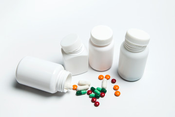 Medicine bottle and medicine on a white background