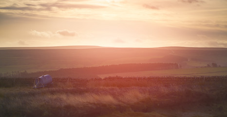 Wall Mural - sunset over forest and farmland in the english countryside. edmondbyres common, uk.