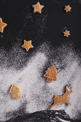 Wall Mural -  Gingerbread. Christmas cookies on a black background.