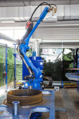 Wall Mural - automatic robot welder at the metalworking plant