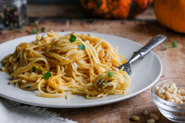 Canvas Print - spaghetti with pumpkin sauce and pine nuts