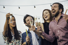 Friends Drinking Champagne Together Outdoors