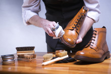 The Process Of Cleaning Shoes. A Man Is Cleaning His Shoes.