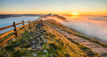 Thick Cloud Inversion With Morning Sun Casting Golden Light On The Landscape. Taken At Mam Tor In The English Peak District.
