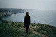 © SHOTPRIME STUDIO - Beautiful young woman on a cliff above the sea, nature