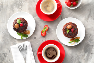 Wall Mural - Chocolate muffins with caramel and coffee on table