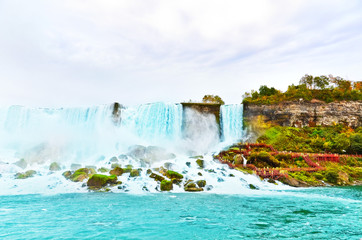 Wall Mural - american side of niagara falls on a cloudy day in autumn.