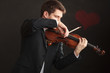 © Voyagerix - Man man dressed elegantly playing violin