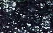 Porphyry porphyrite mineral stone texture pattern macro view. Effusive paleotypic non-quartz rock gem, greenish black white background