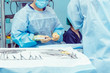 © okrasiuk - Close up hands of surgery assistant prepearing steralized surgical tools for surgery operation. Selective focus