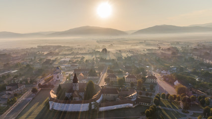 Sticker - sunrise in prejmer village. brasov, romania